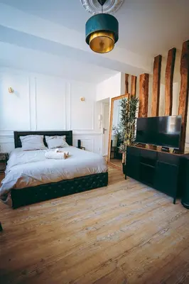 Un ou plusieurs lits dans un hébergement de l'établissement Spa du palais jacuzzi sauna - Rouen centre - free parking
