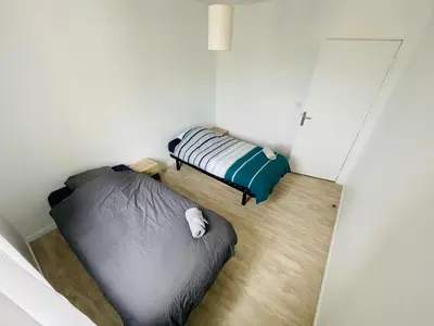 Un ou plusieurs lits dans un hébergement de l'établissement Rouen Confort - 395