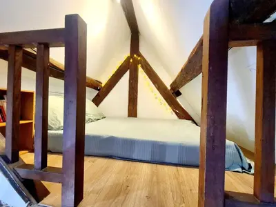 Un ou plusieurs lits dans un hébergement de l'établissement Appartement cosy & mezzanines