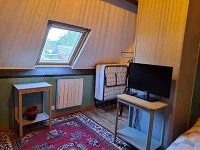 Télévision ou salle de divertissement dans l'établissement Chez Robins