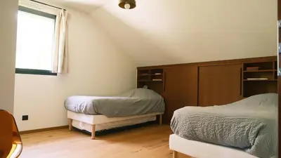 Un ou plusieurs lits dans un hébergement de l'établissement Maison Canadienne au bord du lac