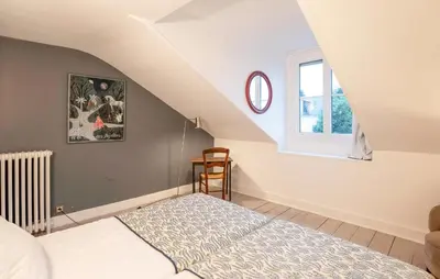 Un ou plusieurs lits dans un hébergement de l'établissement Charmante Maison De Ville