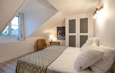 Un ou plusieurs lits dans un hébergement de l'établissement Charmante Maison De Ville