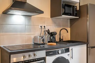 Cuisine ou kitchenette dans l'établissement Appartement La Rive Rouen proche centre historique