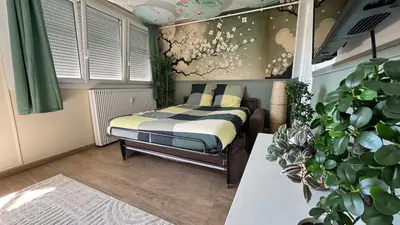 Un ou plusieurs lits dans un hébergement de l'établissement Le Jardin Suspendu