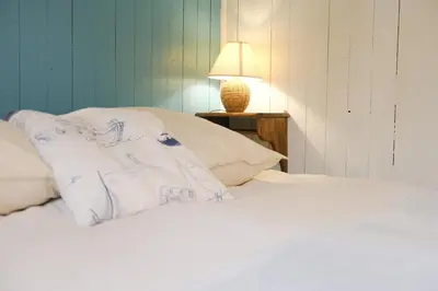 Un ou plusieurs lits dans un hébergement de l'établissement La petite Cabane, 200m de la plage