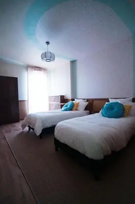 Un ou plusieurs lits dans un hébergement de l'établissement Triplex Design avec Rooftop et Salle Cinéma