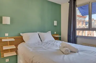 Un ou plusieurs lits dans un hébergement de l'établissement Le Cléa joli F2 au coeur de la ville de Rouen