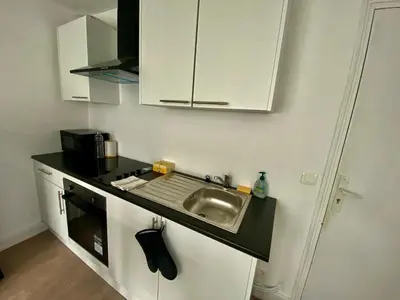 Cuisine ou kitchenette dans l'établissement La cascade de Waddington - 401