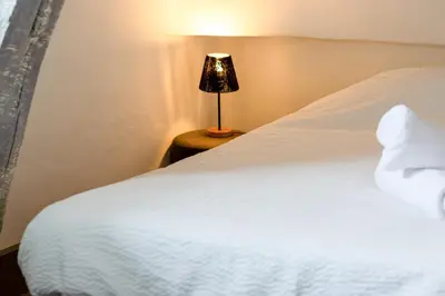 Un ou plusieurs lits dans un hébergement de l'établissement Le Auguste charmant duplex avec terrasse