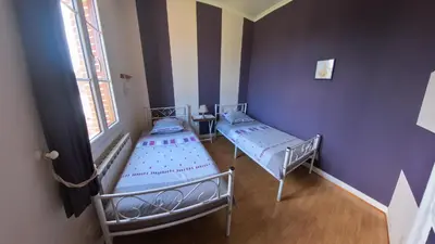 Un ou plusieurs lits dans un hébergement de l'établissement Gîte des Roses