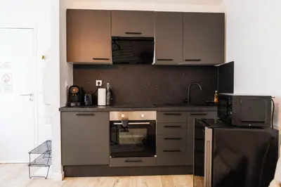 Cuisine ou kitchenette dans l'établissement Le Soleil Cormeillais