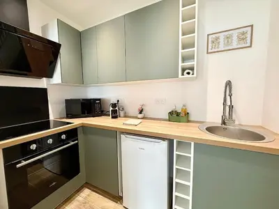 Cuisine ou kitchenette dans l'établissement Appartement le Cocoon, 5 min du port