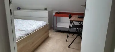 Un ou plusieurs lits dans un hébergement de l'établissement SW Cosy Apart 2 - Persan Chambly