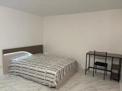 Un ou plusieurs lits dans un hébergement de l'établissement Charmant appartement moderne