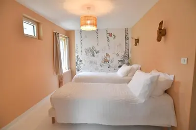 Un ou plusieurs lits dans un hébergement de l'établissement La Maison Forestière