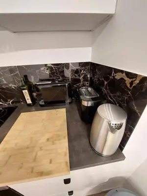 Cuisine ou kitchenette dans l'établissement Cosy Home 4 - Spacieux studio avec parking - 30 min Paris