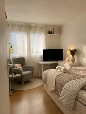 Un ou plusieurs lits dans un hébergement de l'établissement Jolie Chambre Confortable