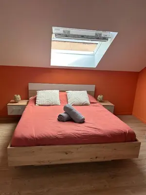 Un ou plusieurs lits dans un hébergement de l'établissement La bulle colorée