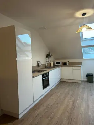 Cuisine ou kitchenette dans l'établissement La bulle colorée