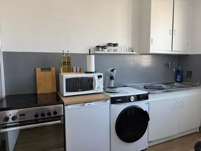 Cuisine ou kitchenette dans l'établissement Studio cosy en hypercentre de Louviers