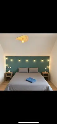 Un ou plusieurs lits dans un hébergement de l'établissement charmant duplex cosy et lumineux