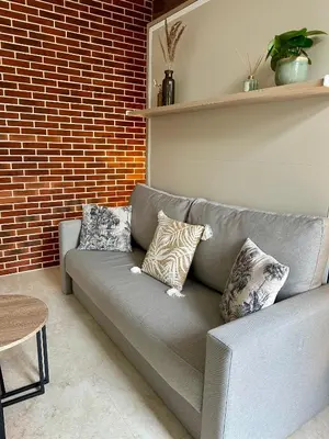 Coin salon dans l'établissement Studio rénové à 2 pas du centre-ville de Senlis