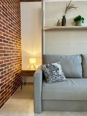 Coin salon dans l'établissement Studio rénové à 2 pas du centre-ville de Senlis