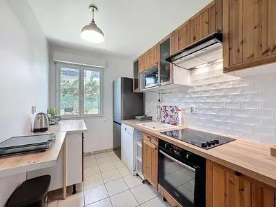 Cuisine ou kitchenette dans l'établissement Apt 5p standing - Paris Cergy pontoise