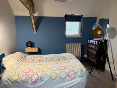 Un ou plusieurs lits dans un hébergement de l'établissement La chambre du Parc