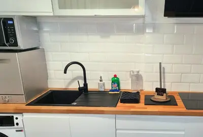 Cuisine ou kitchenette dans l'établissement Maison Duplex Confort-Coté Cour et Jardins-Centre Gare