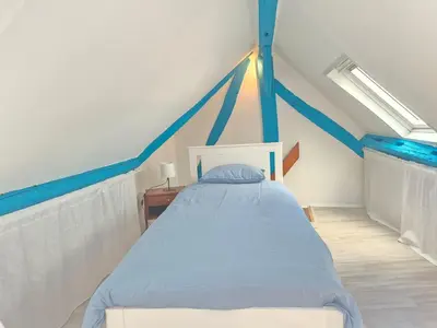 Un ou plusieurs lits dans un hébergement de l'établissement Appartement Centre Historique Rouen Le Vivien