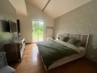 Un ou plusieurs lits dans un hébergement de l'établissement Suite Evasion - Jaccuzzi et petit déjeuner