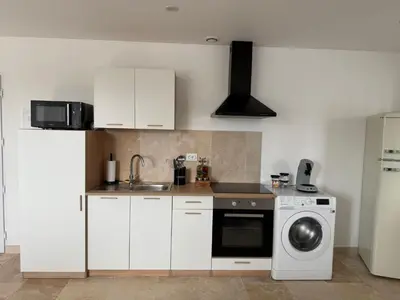 Cuisine ou kitchenette dans l'établissement Le Prestige - Spacieux T3 Neuf et Lumineux