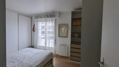 Un ou plusieurs lits dans un hébergement de l'établissement Bel appartement, proche gare, Poissy- Ouest Paris