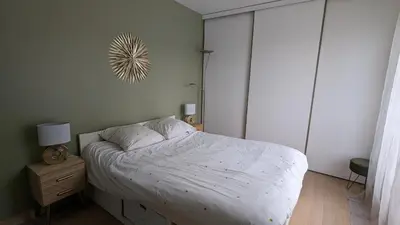 Un ou plusieurs lits dans un hébergement de l'établissement Bel appartement, proche gare, Poissy- Ouest Paris