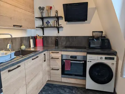 Cuisine ou kitchenette dans l'établissement Charmant T2 centre-ville Amiens