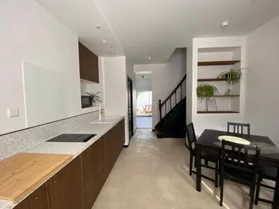 Cuisine ou kitchenette dans l'établissement L'Amienoise Maison 2ch Confort et standing