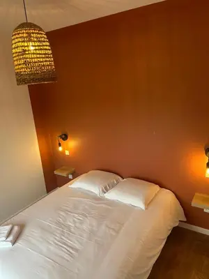 Un ou plusieurs lits dans un hébergement de l'établissement Lodges La Chouette Nuit