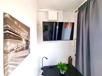 Télévision ou salle de divertissement dans l'établissement Studio Moderne Bien Pensé
