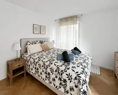 Un ou plusieurs lits dans un hébergement de l'établissement Balcon privé Parking & Fibre Proche Paris