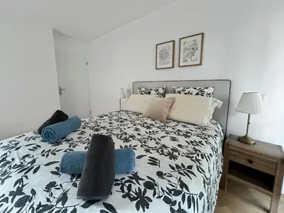 Un ou plusieurs lits dans un hébergement de l'établissement Balcon privé Parking & Fibre Proche Paris