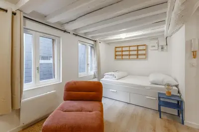 Un ou plusieurs lits dans un hébergement de l'établissement Studio centre historique - Le Beauvoisin - WiFi