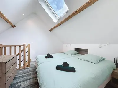 Un ou plusieurs lits dans un hébergement de l'établissement Maisonnette 49m2 à 5 minutes de chantilly
