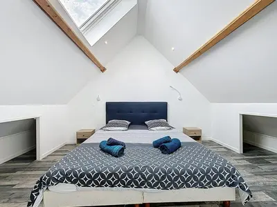 Un ou plusieurs lits dans un hébergement de l'établissement Maisonnette 49m2 à 5 minutes de chantilly