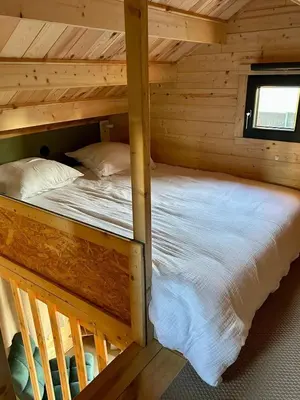 Un ou plusieurs lits dans un hébergement de l'établissement Cosy Lodgy