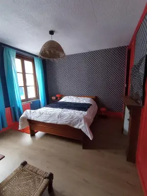 Un ou plusieurs lits dans un hébergement de l'établissement maison au charme rétro, équipée et tranquille