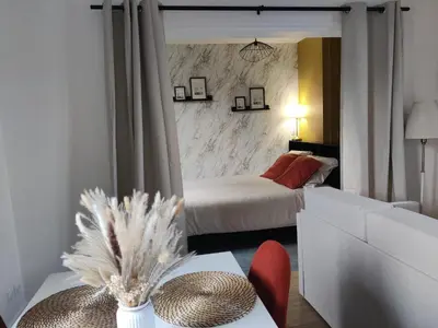 Un ou plusieurs lits dans un hébergement de l'établissement Studio Cosy