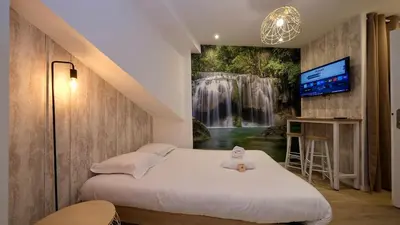 Un ou plusieurs lits dans un hébergement de l'établissement Studio pratique et cosy Rouen centre