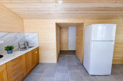 Cuisine ou kitchenette dans l'établissement Le chalet au bord de seine